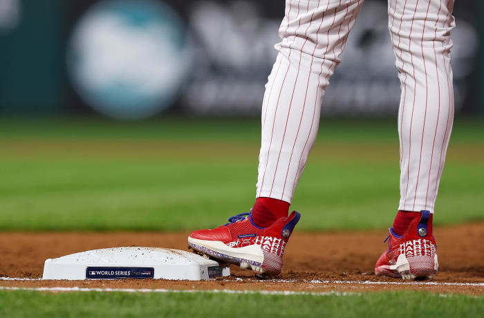 View of Bryce Harper's cleats as he stands on first base.